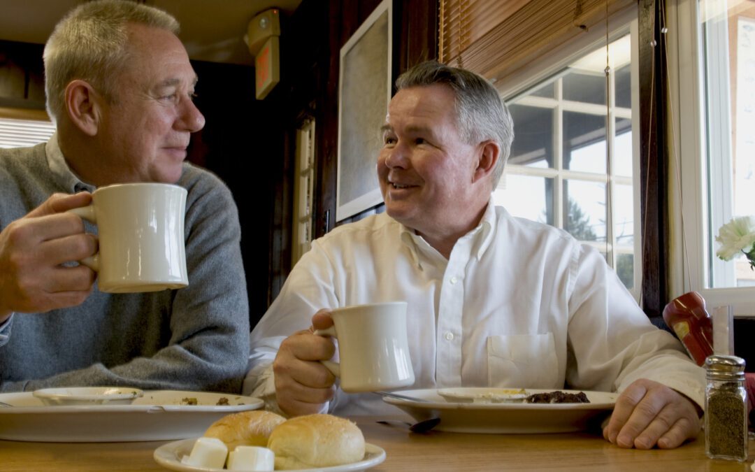 Two senior men in a restaurant.